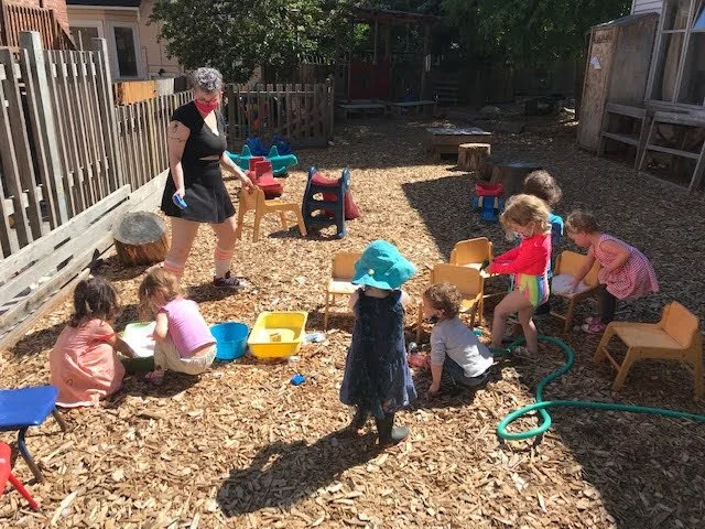 Children enjoying water play on the playground